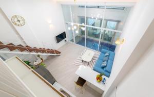 an overhead view of the living room of a house with a pool at Patio Pool Villa in Gyeongju