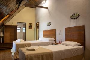 Katil atau katil-katil dalam bilik di Hotel Dona Paschoalina
