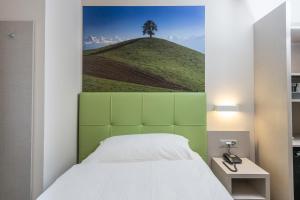 Krevet ili kreveti u jedinici u okviru objekta Adhhoc Hotel