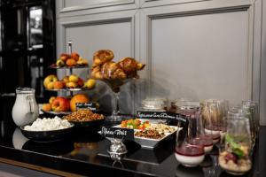 a buffet with different types of food on a table at Wall Street - Maestro in Odesa