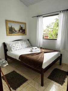 Säng eller sängar i ett rum på Casa Perto do Centro