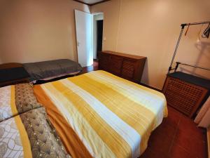 Uma cama ou camas num quarto em Chalet Combava