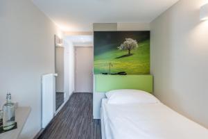 Krevet ili kreveti u jedinici u okviru objekta Adhhoc Hotel