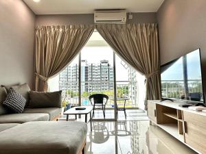 a living room with a couch and a large window at IJM Condo with Pool #Yoyo Homestay in Sandakan