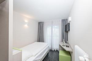 Krevet ili kreveti u jedinici u okviru objekta Adhhoc Hotel