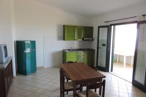 Una cocina o zona de cocina en Le Colline di Isola Rossa