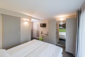 Krevet ili kreveti u jedinici u okviru objekta Adhhoc Hotel