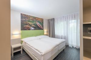 Krevet ili kreveti u jedinici u okviru objekta Adhhoc Hotel