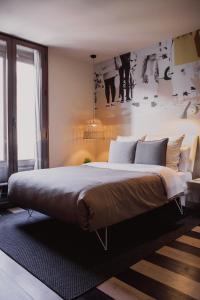 a bedroom with a large bed in a room at room Select Sol in Madrid