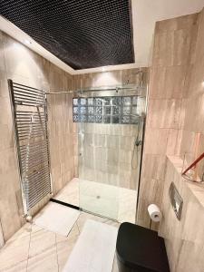 a bathroom with a shower with a glass door at Casa dell'Inno di Mameli in Turin +32 photos