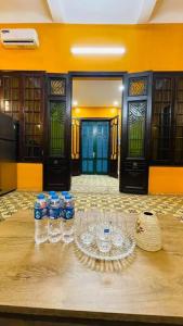 a group of bottles of water sitting on a table at Old Quarter Autumn Hanoi in Hanoi