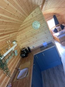 an overhead view of a cabin with a clock on the wall at Dwell on the Moor in Holme upon Spalding Moor