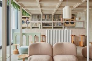 a living room with two chairs and a table at Locke at East Side Gallery in Berlin