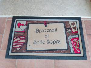 Majutusasutuses Il sottosopra olev sertifikaat, autasu, silt või muu dokument