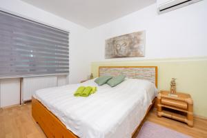 Postel nebo postele na pokoji v ubytování Greenhouse Adria