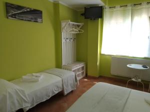 Voodi või voodid majutusasutuse Il sottosopra toas