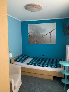 a bedroom with a bed with a bridge on the wall at Bartels Stadt-Hotel in Werl