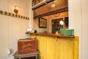 a bar with a suitcase sitting in front of it at The Charlotte Hotel & Restaurant in Onancock