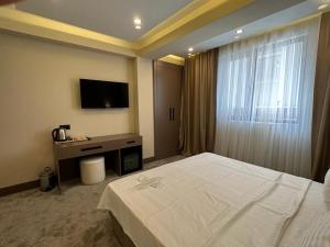 Postel nebo postele na pokoji v ubytování Istanblu Hotel Ataşehir