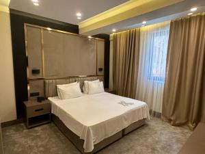 Postel nebo postele na pokoji v ubytování Istanblu Hotel Ataşehir