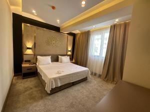 Postel nebo postele na pokoji v ubytování Istanblu Hotel Ataşehir