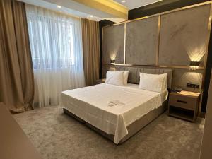 Postel nebo postele na pokoji v ubytování Istanblu Hotel Ataşehir
