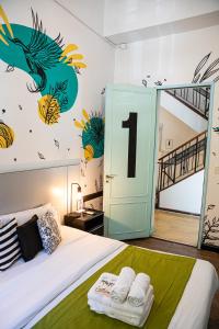a bedroom with a bed with a number one on the wall at Art Factory Soho in Buenos Aires