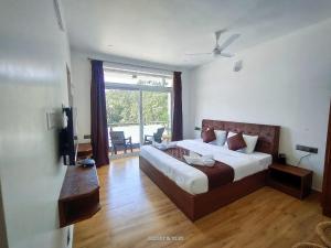 Voodi või voodid majutusasutuse Hotel NT Grand Yercaud toas