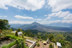 a view of a mountain from a house at Tegal Sari Cabin Kintamani in Kintamani