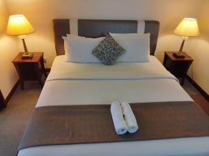 Ліжко або ліжка в номері Bintang Royal Casa Suites Times Square KL