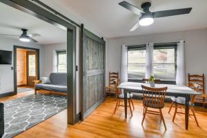 a living room with a table and a couch at Mullens Home - Close to Hatfield-McCoy Trailhead! in Mullens