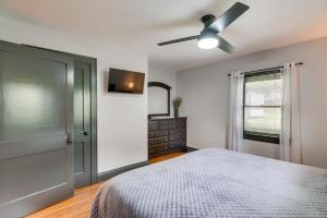 a bedroom with a bed and a ceiling fan at Mullens Home - Close to Hatfield-McCoy Trailhead! in Mullens
