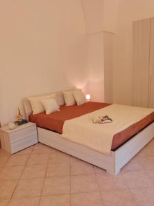 a bedroom with a large bed in a room at Appartamento Le Volte in Soleto