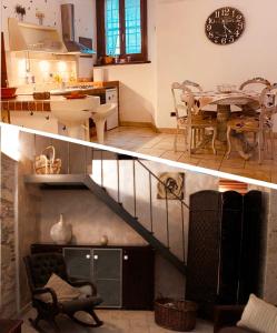 cocina y sala de estar con escalera y mesa en L'antico Pozzo, en Sulmona