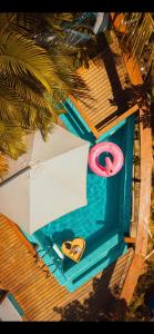 an overhead view of a pool with a lifesaver and a pool at Altavista residence in Morro de São Paulo