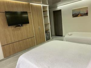 Una cama o camas en una habitación de NORTE REAL HOTEL