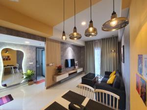 a living room with a couch and a tv at Tony Apartment Soho Q1 in Ho Chi Minh City