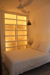Łóżko lub łóżka w pokoju w obiekcie Beach Apartment - Benalmadena Costa