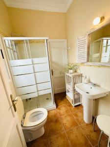 a bathroom with a toilet and a sink at Atlantic View La Caleta Adeje in Adeje