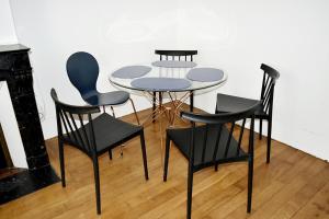 a table and four chairs in a room at CdH Lantiez in Paris