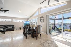 a dining room with a table and chairs at Villa Thunderbird View, Cape Coral in Cape Coral