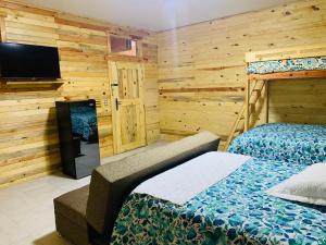 Postel nebo postele na pokoji v ubytování Rimusa Inn