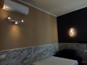 Postel nebo postele na pokoji v ubytování AURY HOME -Corso XX Settembre
