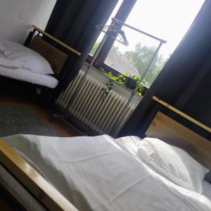 a bedroom with a bed and a window with a radiator at Monteurzimmer in Hamburg West bei Hansezimmer in Hamburg