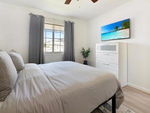 a white bedroom with a bed and a window at Discount For 30 Days Plus Stay In Culver City in Los Angeles