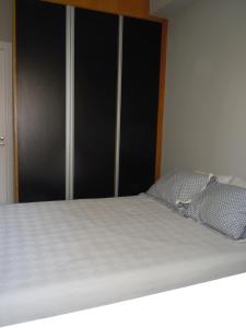 zbliżenie łóżka w sypialni w obiekcie PHD - Personal Home Design w São Paulo