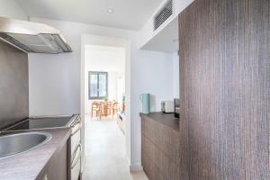 a kitchen with a sink and a counter top at Small private house 4P1BR - Marseille 8th in Marseille