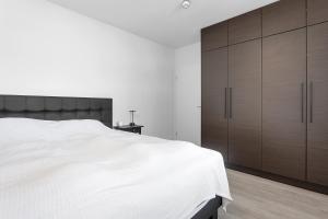 Postel nebo postele na pokoji v ubytování Modern 1BR Apartment in Reykjavík