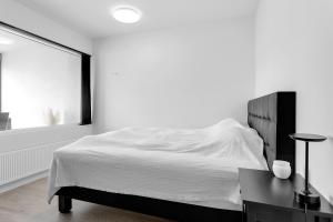 Postel nebo postele na pokoji v ubytování Modern 1BR Apartment in Reykjavík