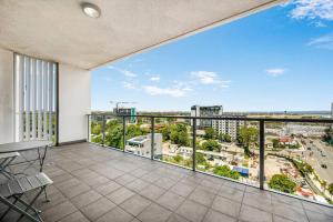 a balcony with a view of a city at Spacious 2 beds Apt near Airport in Sydney